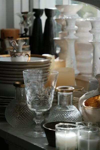 Collection of decorative vases, glasses, and candles